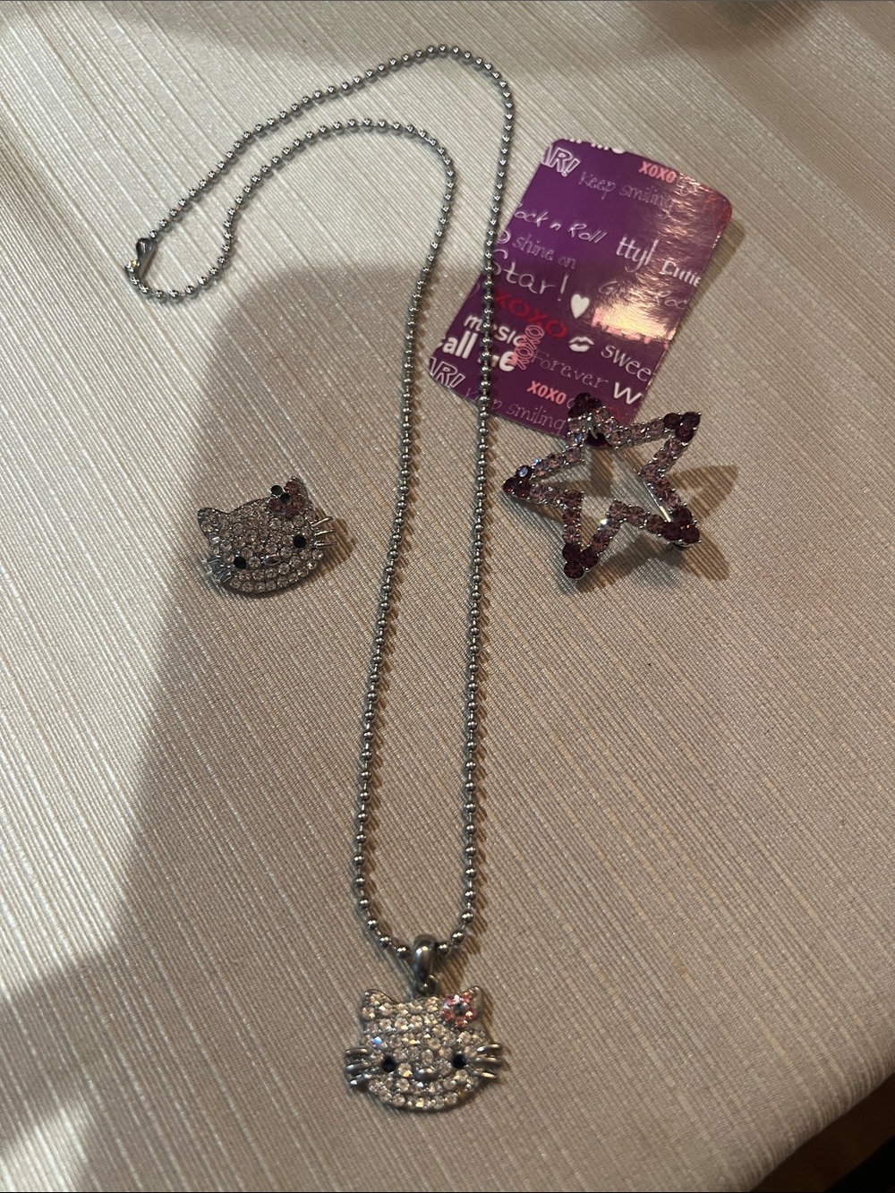 Crystal Hello Kitty Face Necklace & Matching pin. Plus purple star pin!